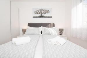 Postel nebo postele na pokoji v ubytování Studio Apartman Apollonia