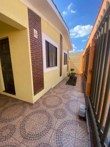 a balcony of a building with a tiled floor at Hospedaria Spring in Alfenas