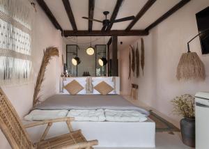 a bedroom with a bed in a room at Kynthia Hotel - Adults Only in Kalogria