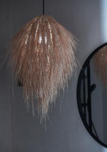a close up of a light fixture with a mirror at Kynthia Hotel - Adults Only in Kalogria