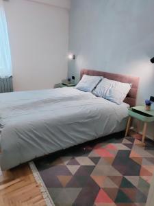 Ένα ή περισσότερα κρεβάτια σε δωμάτιο στο AmforA Apartment