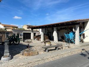 a building with a bench in front of it at Su Tostobiu in San Nicolò dʼArcidano