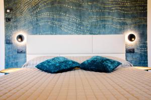 Posteľ alebo postele v izbe v ubytovaní Bellevue - Rooms & Suites