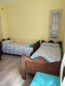Llit o llits en una habitació de Hostel Ayacucho