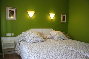 Postel nebo postele na pokoji v ubytování Hostal Paris