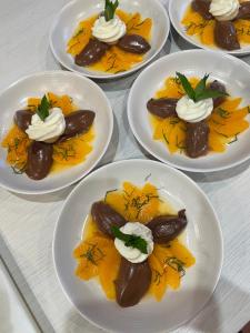 a group of plates of food on a table at Le Clos du Q’hâtre in Cléry-Saint-André