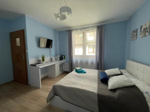 Posteľ alebo postele v izbe v ubytovaní Apartamenty ''Chcę Tu Zostać''