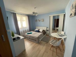 Posteľ alebo postele v izbe v ubytovaní Apartamenty ''Chcę Tu Zostać''
