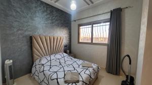 מיטה או מיטות בחדר ב-Bel appartement dans une résidence calme