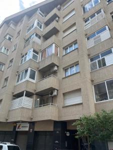 an apartment building with balconies on the side of it at Pedro in Roses