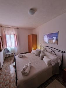 Postel nebo postele na pokoji v ubytování Mammaioa house + 37 fotografií