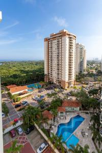 an aerial view of a resort with two pools at Lobie Barra da Tijuca Mundo Novo in Rio de Janeiro