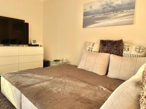 Katil atau katil-katil dalam bilik di Lovely apartment in Neustadt +21 gambar