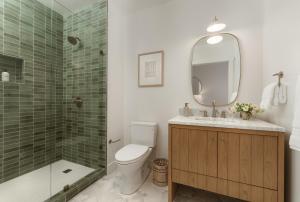 a bathroom with a toilet and a shower and a sink at The Inn At Anatega #3 in Santa Barbara