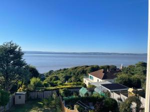 a view of the ocean from a house at Home in Portishead