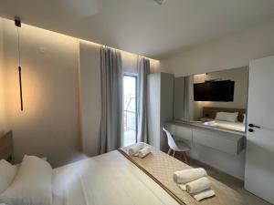 Кровать или кровати в номере Okkio Sea View