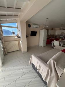 a large kitchen and living room with a large window at Casa delle Stelle in Mondello