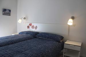 A bed or beds in a room at Madrid Rent 2
