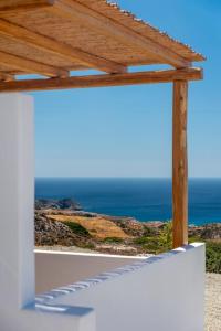a view of the ocean from a building with a wooden roof at Alisahni Studio Sea View in Paleochori