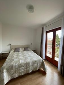 Postel nebo postele na pokoji v ubytování Apartments Kekel