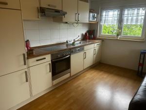 a kitchen with a sink and a stove top oven at Ferienwohnung Soe in Wittenbeck
