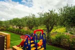 a childrens play set in a garden at Casa Vacanze - Residence Villa Don Salvatore in Agropoli