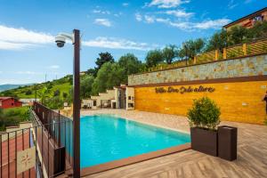 a swimming pool in front of a building at Casa Vacanze - Residence Villa Don Salvatore in Agropoli