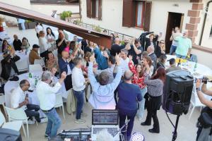 a crowd of people standing in a room with their hands in the air at Casa Vacanze - Residence Villa Don Salvatore in Agropoli +118 photos