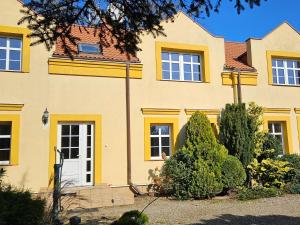 a yellow house with yellow windows at holiday home, Kolczewo in Kołczewo