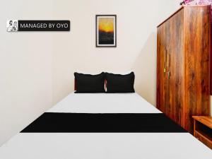En eller flere senge i et værelse på OYO Okkilipalayam