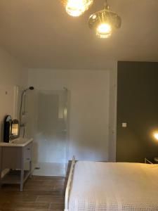 Ένα ή περισσότερα κρεβάτια σε δωμάτιο στο Chambre d’hôtes