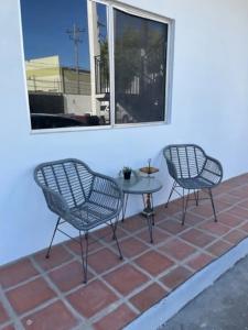 two chairs and a table on a patio at Villa Angel in Tijuana +59 photos