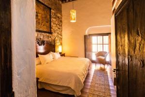 Postel nebo postele na pokoji v ubytování Hotel Boutique Mesón de la Abundancia