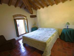 A bed or beds in a room at Agriturismo Le Vigne di Pace