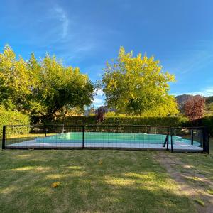 a tennis court in the middle of a yard at El Solar Casas de Campo 3 in Valle Grande