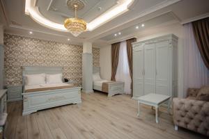 Postel nebo postele na pokoji v ubytování Ervini Boutique Hotel