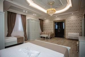 Postel nebo postele na pokoji v ubytování Ervini Boutique Hotel