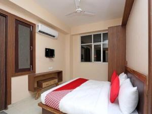Krevet ili kreveti u jedinici u objektu OYO Flagship Grand Aashirwad