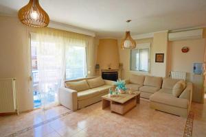 a living room with two couches and a coffee table at LOVELY AND SUNNY APARTAMENT 300m FROM BEACH!! in Perea