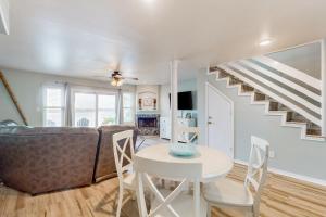 a living room with a couch and a table at Blue Crab Bungalow in Padre Island
