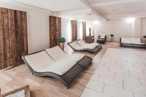 a living room with two beds and a couch at ALPENNEST - AlpenLuxus Collection in Seefeld in Tirol