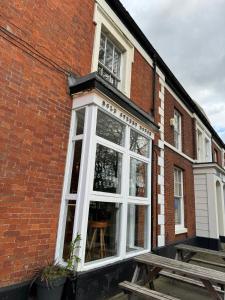 a window on the side of a brick building at Bold Street House in Warrington