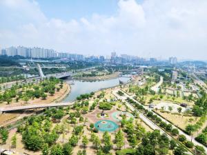 an aerial view of a city with a river at Park View Terrace in Paju