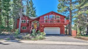 a red house with a deck and a garage at Blackfoot Family Estate in South Lake Tahoe