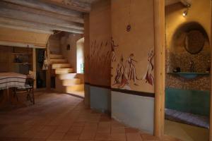a room with stairs and paintings on the wall at Stonehome Pojata in Rušići +61 photos