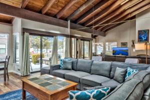a living room with a couch and a table at Lakeland Village 603 Lakeview - See Ski Tahoe-Steps to Lake in South Lake Tahoe