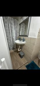 a bathroom with a sink and a mirror at HOUSE SAN FILIPPO in Naples