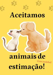 un perro y un gato se están besando en Vila Santa Rosa, en Ilhabela
