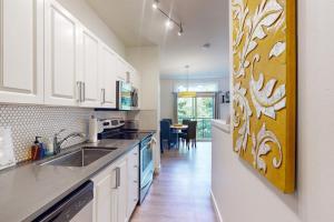 a kitchen with a sink and a counter top at Belltown Court Space Needle Studio in Seattle