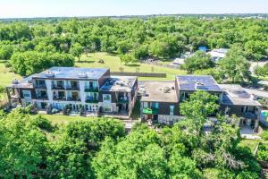 an aerial view of a large house with trees at SS 4B Riverside Condo in New Braunfels